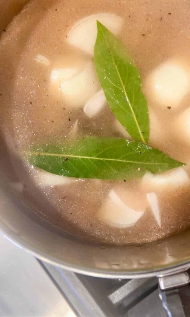 beef, onions and bay leaves with water to make a broth