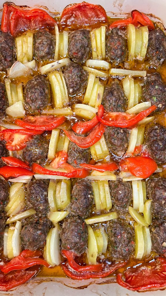 kafta kebabs baked with slices potatoes and tomatoes